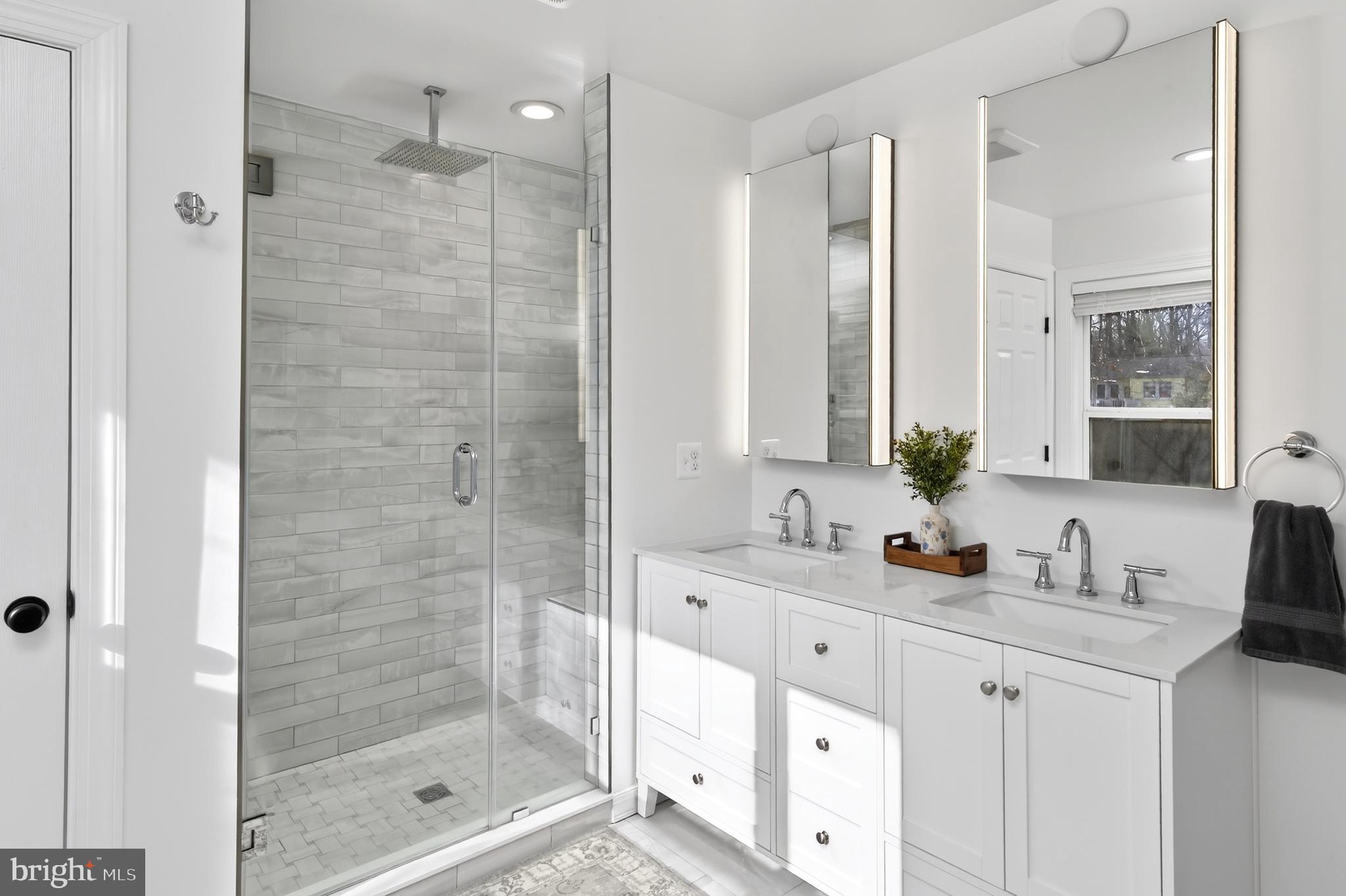 1507 Manor View Road Davidsonville, MD 21035 - Photo 12 of 45 a bathroom with a shower sink and mirror