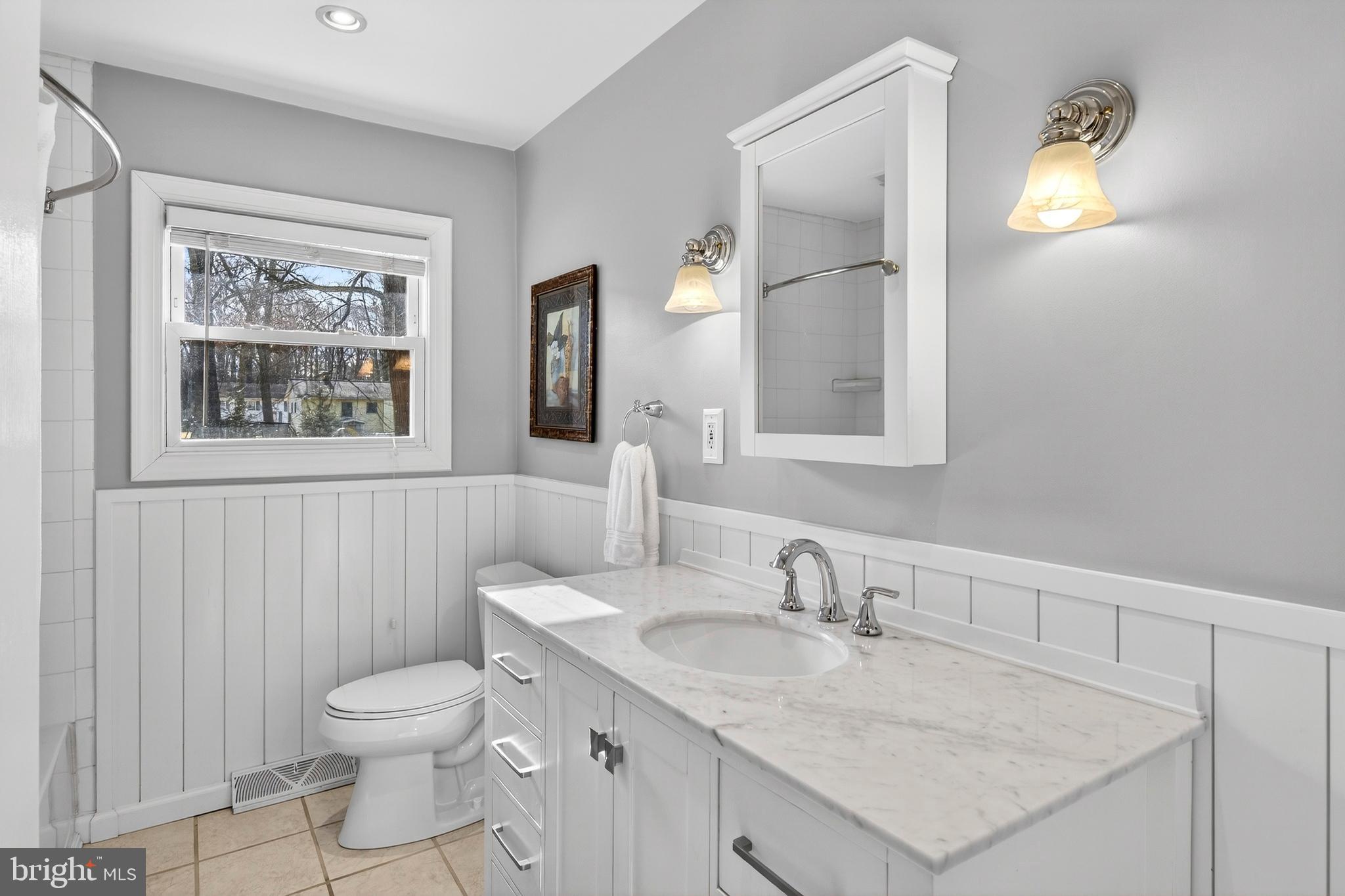 1507 Manor View Road Davidsonville, MD 21035 - Photo 18 of 45 a bathroom with a granite countertop sink toilet and mirror