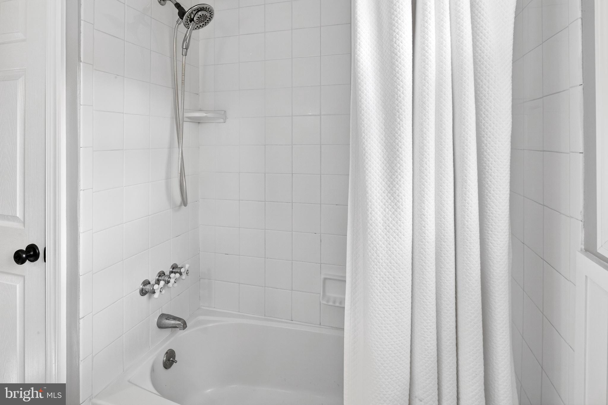 1507 Manor View Road Davidsonville, MD 21035 - Photo 19 of 45 a bathroom with a shower and a bath tub