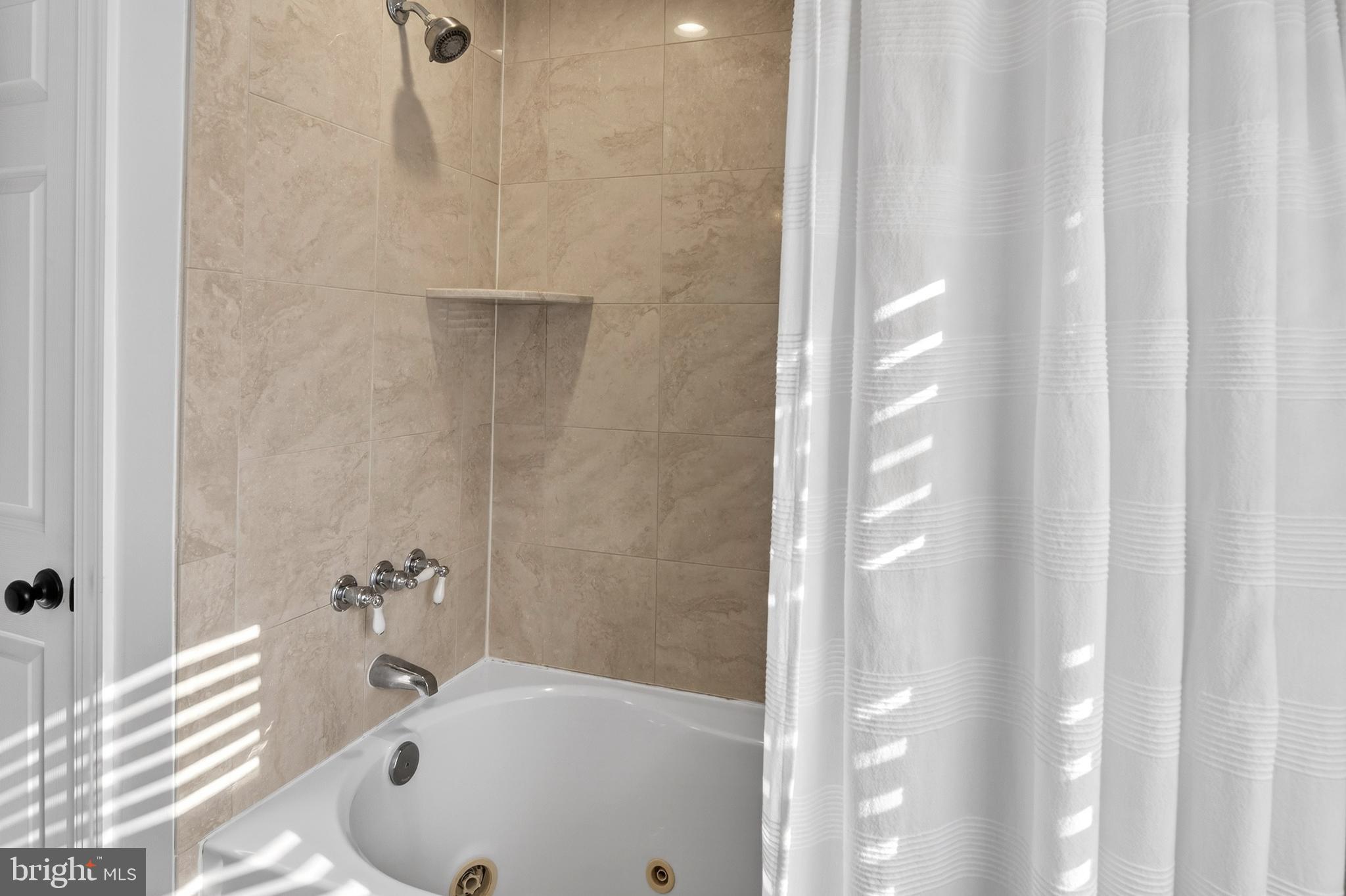 1507 Manor View Road Davidsonville, MD 21035 - Photo 25 of 45 a bathroom with a sink and a tub