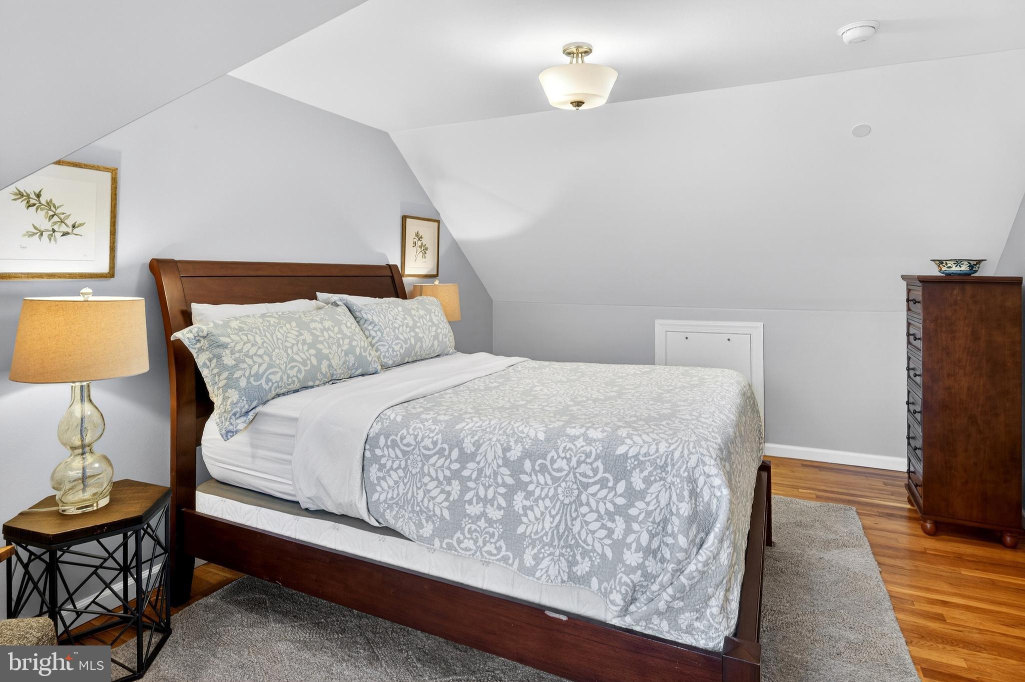 1507 Manor View Road Davidsonville, MD 21035 - Photo 27 of 45 a bedroom with a bed and wooden floor