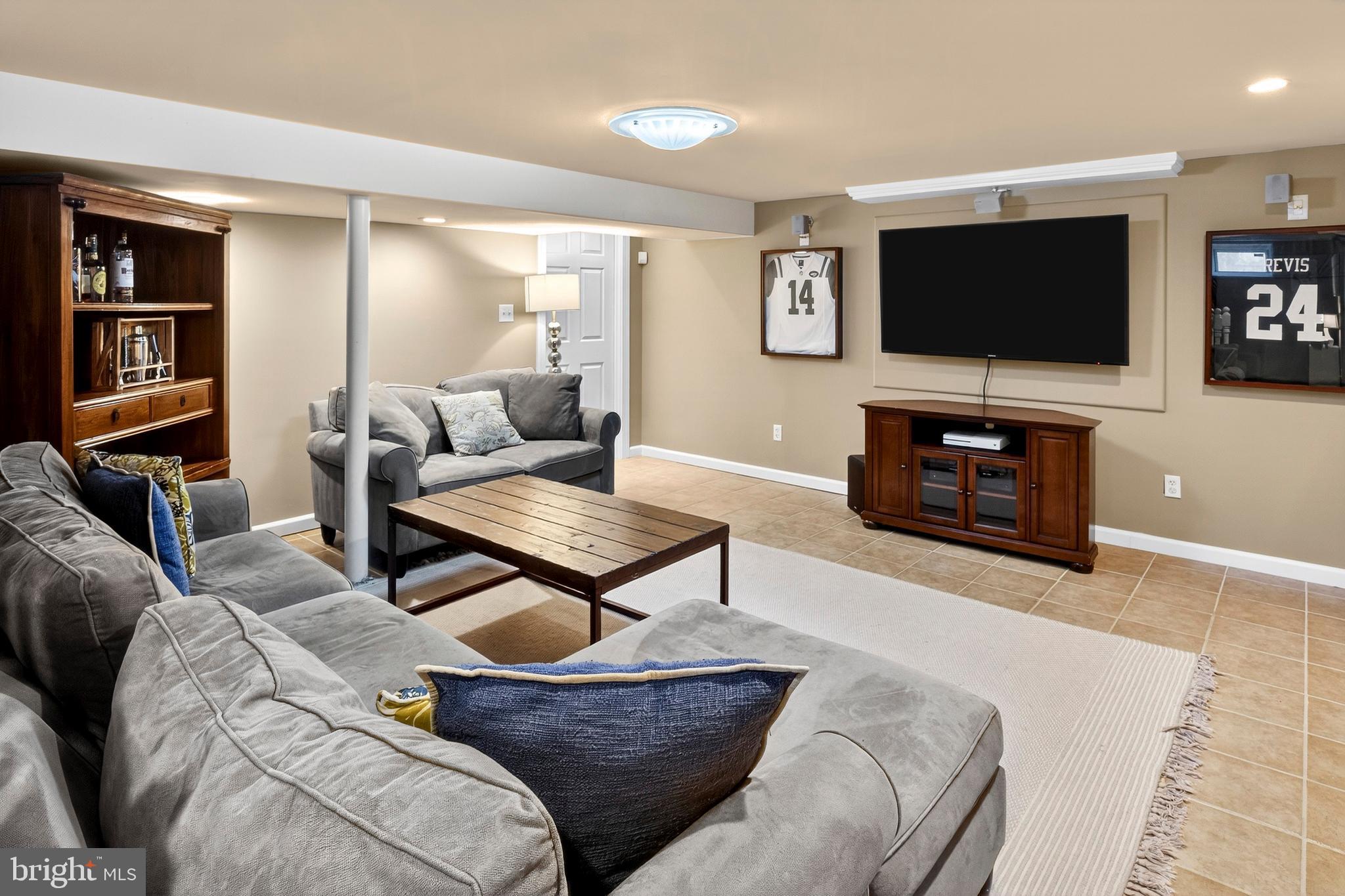 1507 Manor View Road Davidsonville, MD 21035 - Photo 29 of 45 a living room with furniture and a flat screen tv