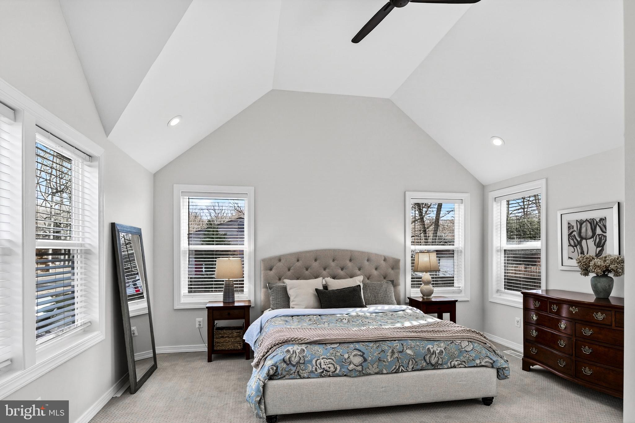 1507 Manor View Road Davidsonville, MD 21035 - Photo 3 of 45 a bedroom with a large bed and a chandelier