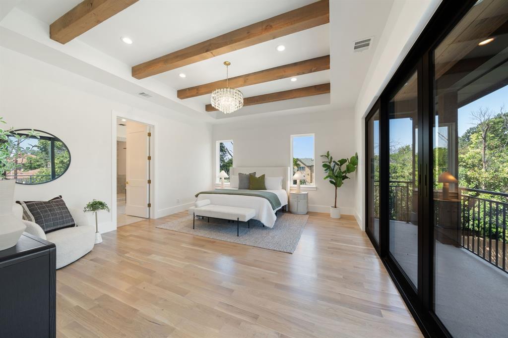 6437 Churchill Way Dallas, TX 75230 - Photo 18 of 38 a living room with furniture and a floor to ceiling window