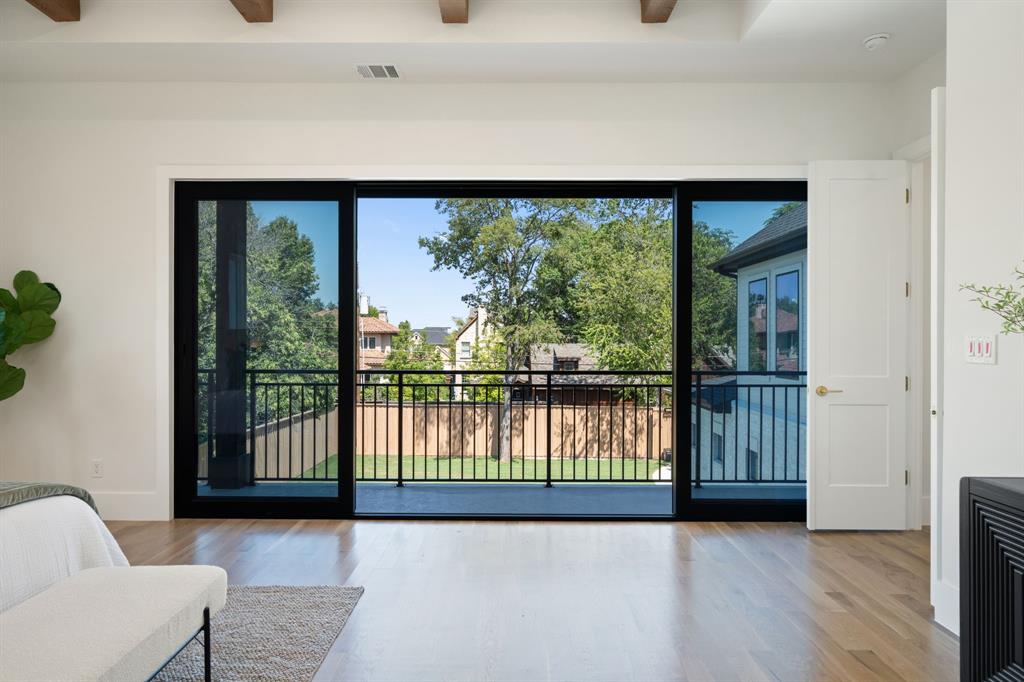 6437 Churchill Way Dallas, TX 75230 - Photo 21 of 38 a view of a living room and a balcony