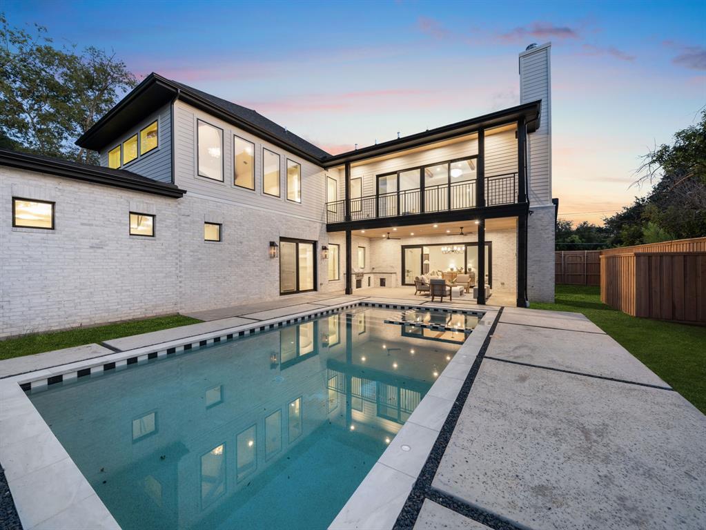 6437 Churchill Way Dallas, TX 75230 - Photo 37 of 38 a front view of a house with a yard