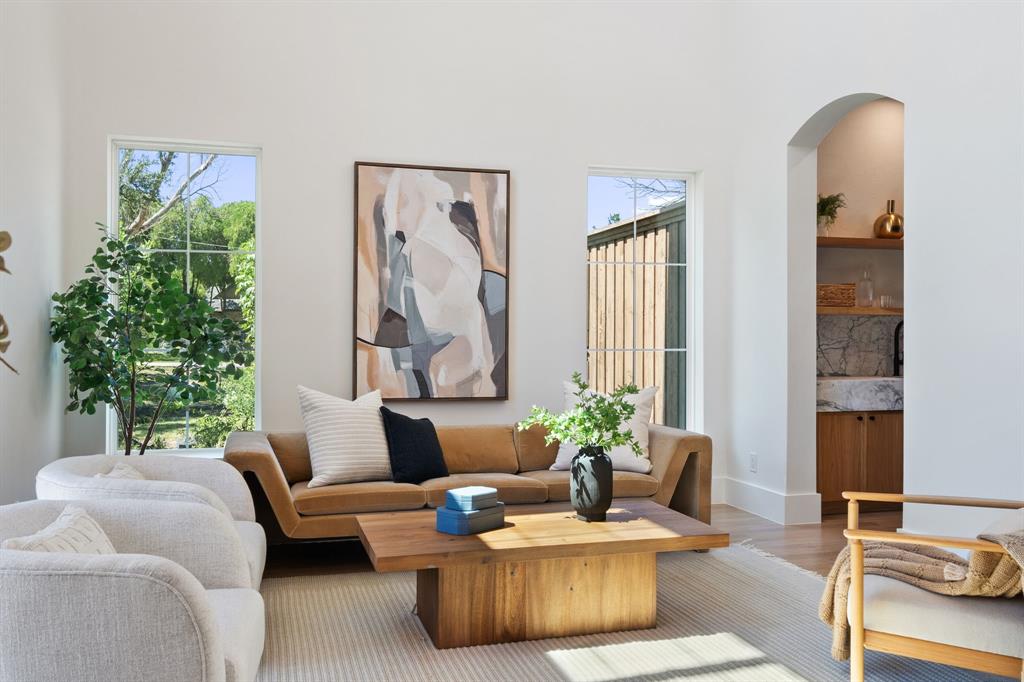 6437 Churchill Way Dallas, TX 75230 - Photo 4 of 38 a living room with furniture and a potted plant