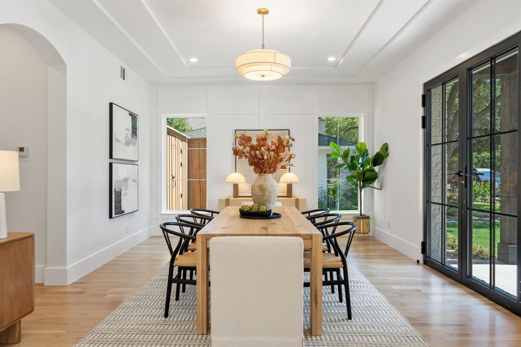 6437 Churchill Way Dallas, TX 75230 - Photo 7 of 38 a view of a dining room with furniture window and wooden floor