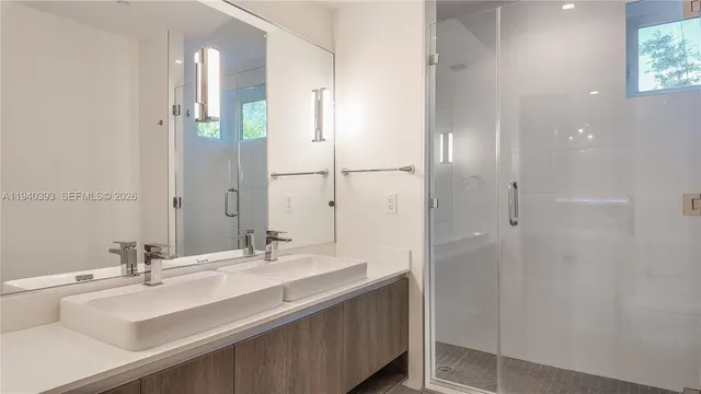 a bedroom with a bed and a chair