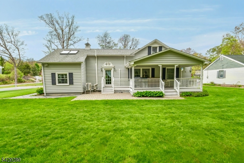 16 Pequot Trail Oak Ridge, NJ 07438 - Photo 16 of 18 a front view of a house with a yard