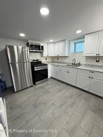 a bathroom with a tub and a shower