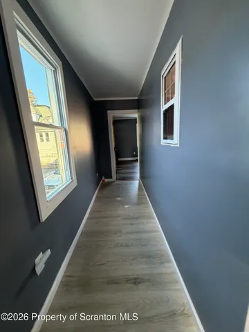 a bedroom with a bed and a ceiling fan