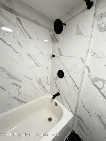 a view of a balcony with wooden floor