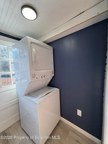 a view of a yard with wooden fence