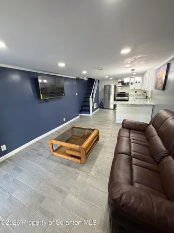 a stove top oven sitting inside of a kitchen