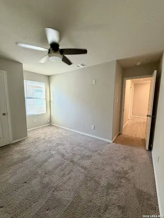 an empty room with a empty space and windows