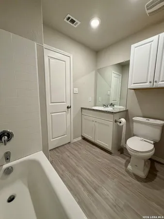 a view of porch with a bench