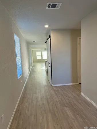 a house view with a trees in the background