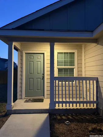 a view of house with outdoor space and sitting area