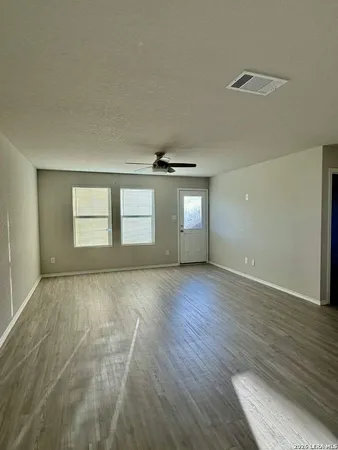 a large kitchen with stainless steel appliances granite countertop a stove a sink and a refrigerator