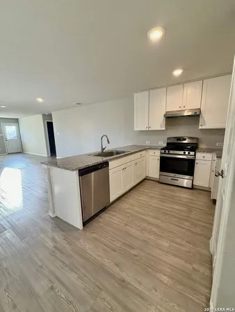 an empty room with a empty space and windows