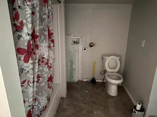 a front view of a house with yard and green space