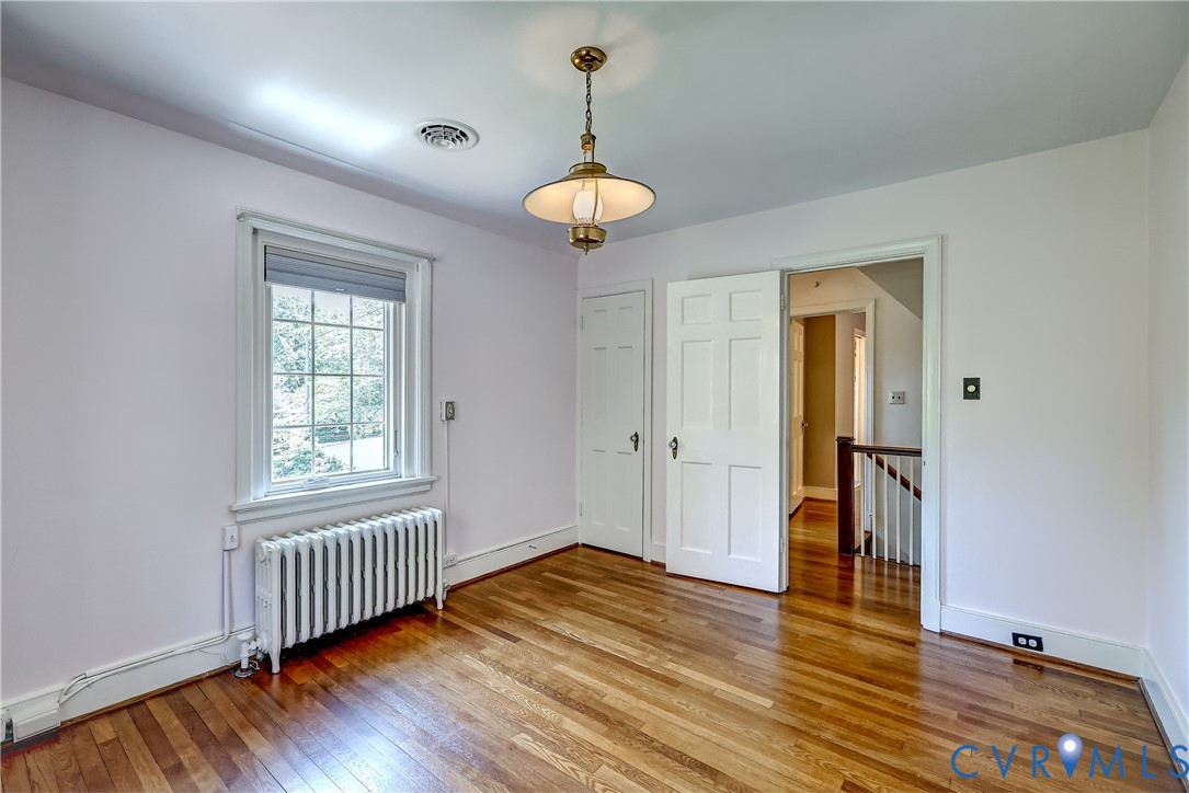 4814 Riverside Drive Richmond, VA 23225 - Photo 27 of 39 wooden floor in an empty room with a window