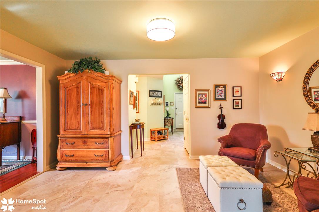 4191 Walter Road Bethlehem, PA 18020 - Photo 6 of 23 Natural light illuminates the versatile living space, featuring smooth, polished tile flooring.