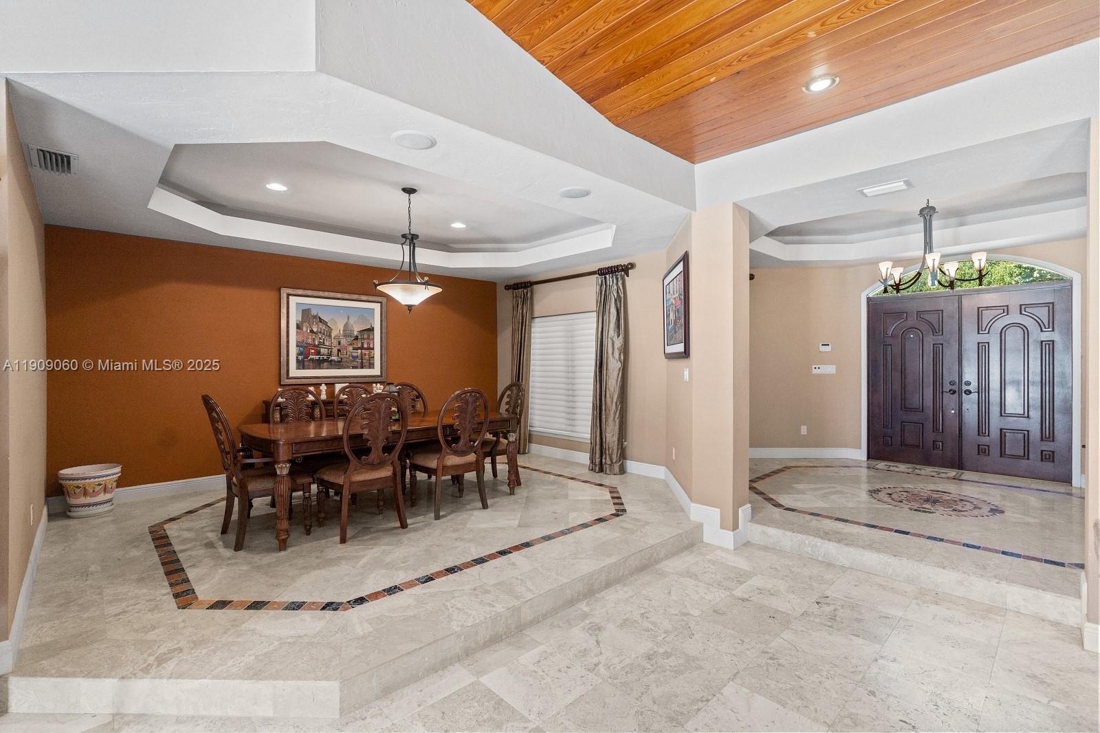 6500 Southwest 127th Street Pinecrest, FL 33156 - Photo 13 of 68 a view of a dining room with furniture