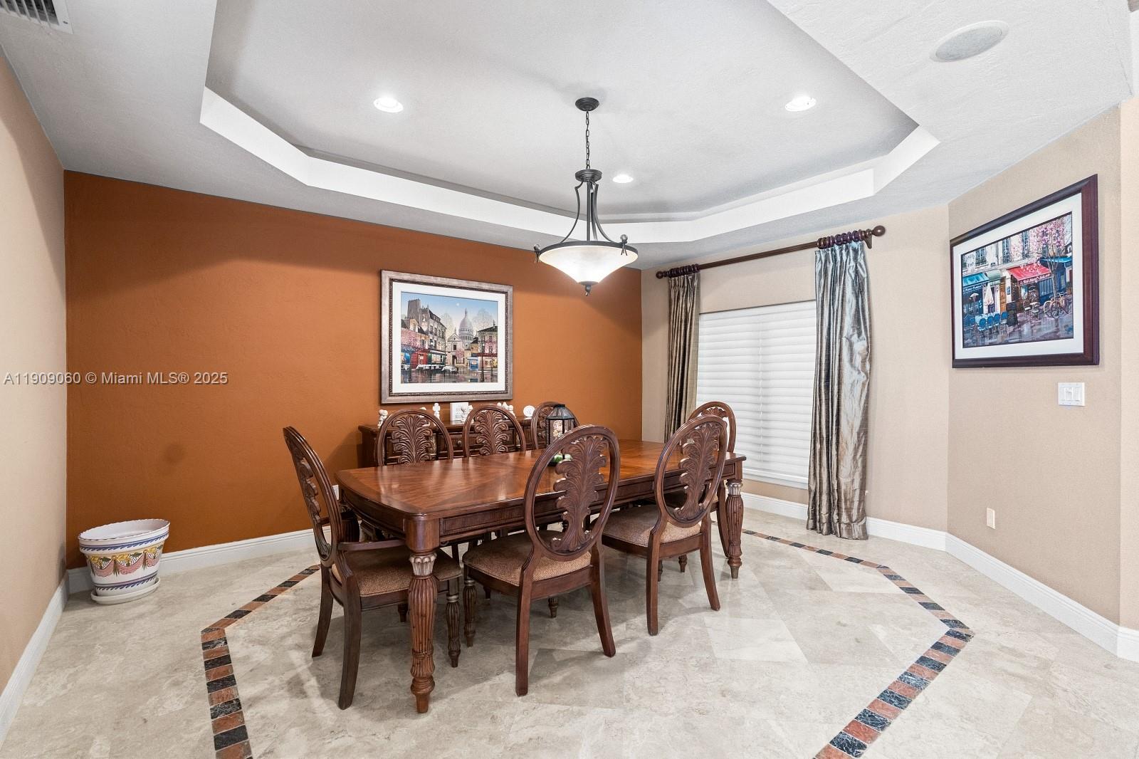 6500 Southwest 127th Street Pinecrest, FL 33156 - Photo 14 of 68 a dining room with furniture a chandelier and window