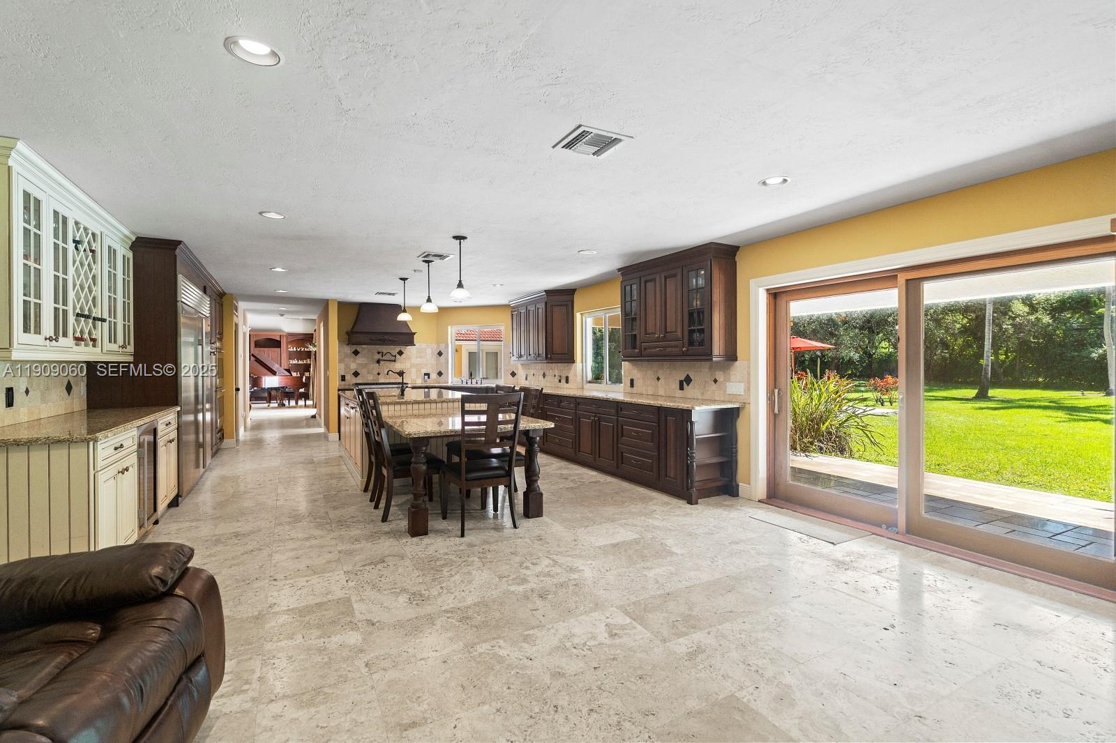 6500 Southwest 127th Street Pinecrest, FL 33156 - Photo 22 of 68 a view of a dining room with furniture window and outside view