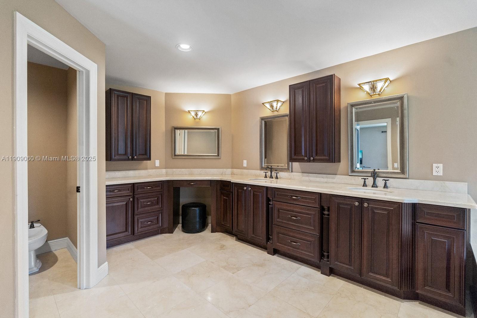 6500 Southwest 127th Street Pinecrest, FL 33156 - Photo 29 of 68 a spacious bathroom with a double vanity sink double and mirror