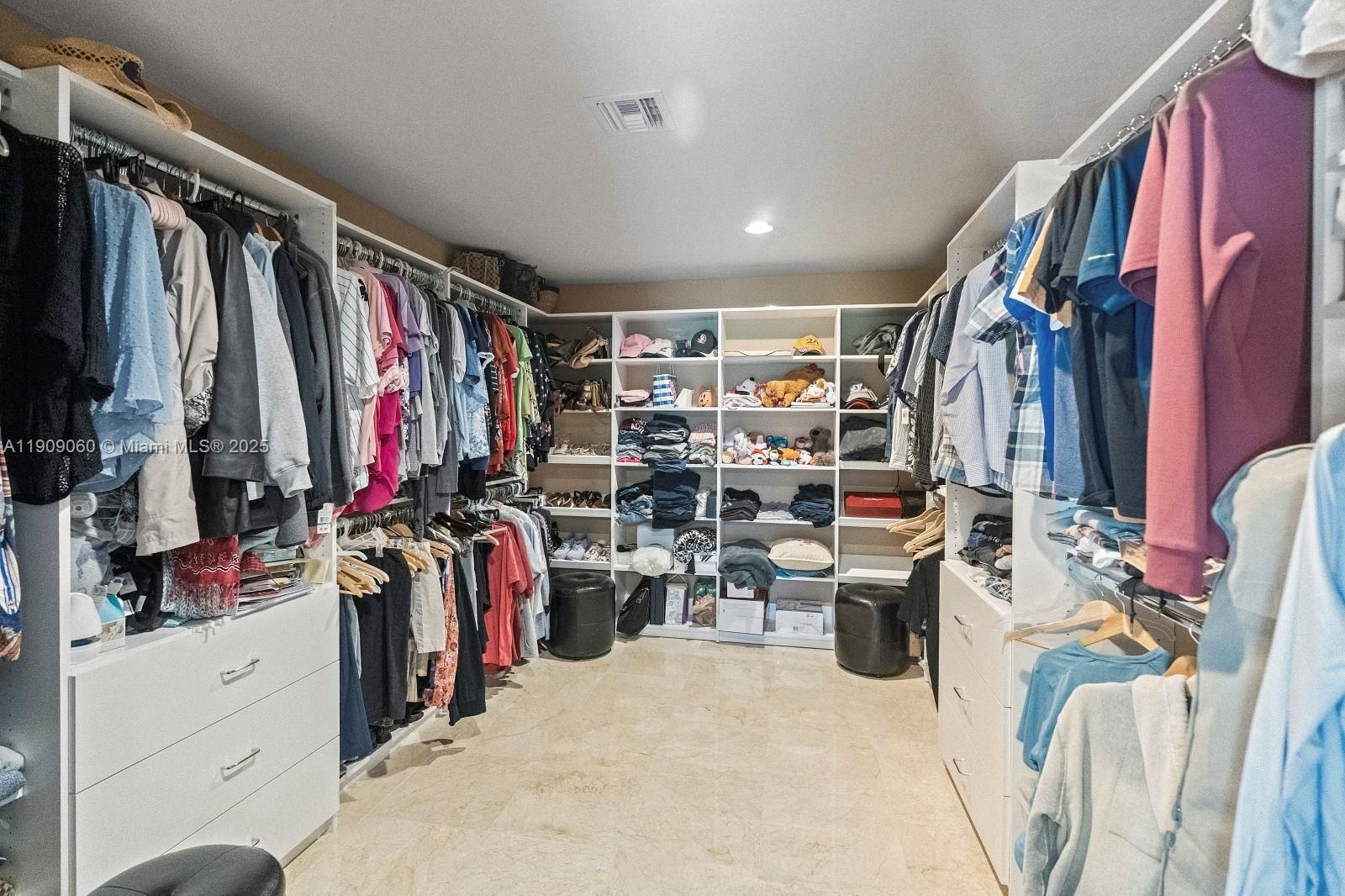 6500 Southwest 127th Street Pinecrest, FL 33156 - Photo 30 of 68 a view of walk in closet with clothes and shoes