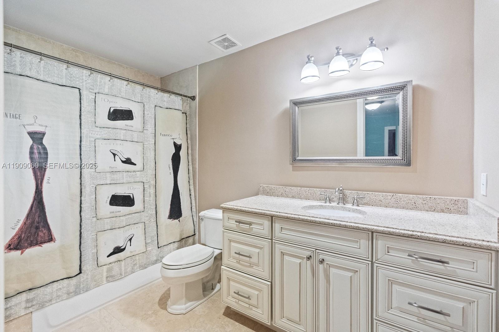 6500 Southwest 127th Street Pinecrest, FL 33156 - Photo 33 of 68 a bathroom with a sink a toilet and shower