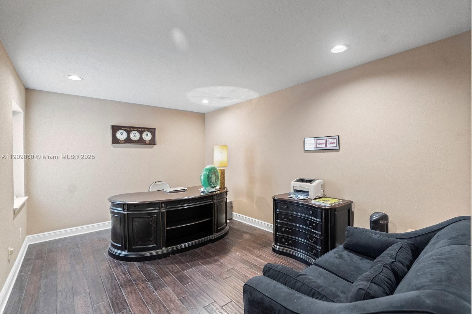 6500 Southwest 127th Street Pinecrest, FL 33156 - Photo 38 of 68 a living room with furniture and a wooden floor