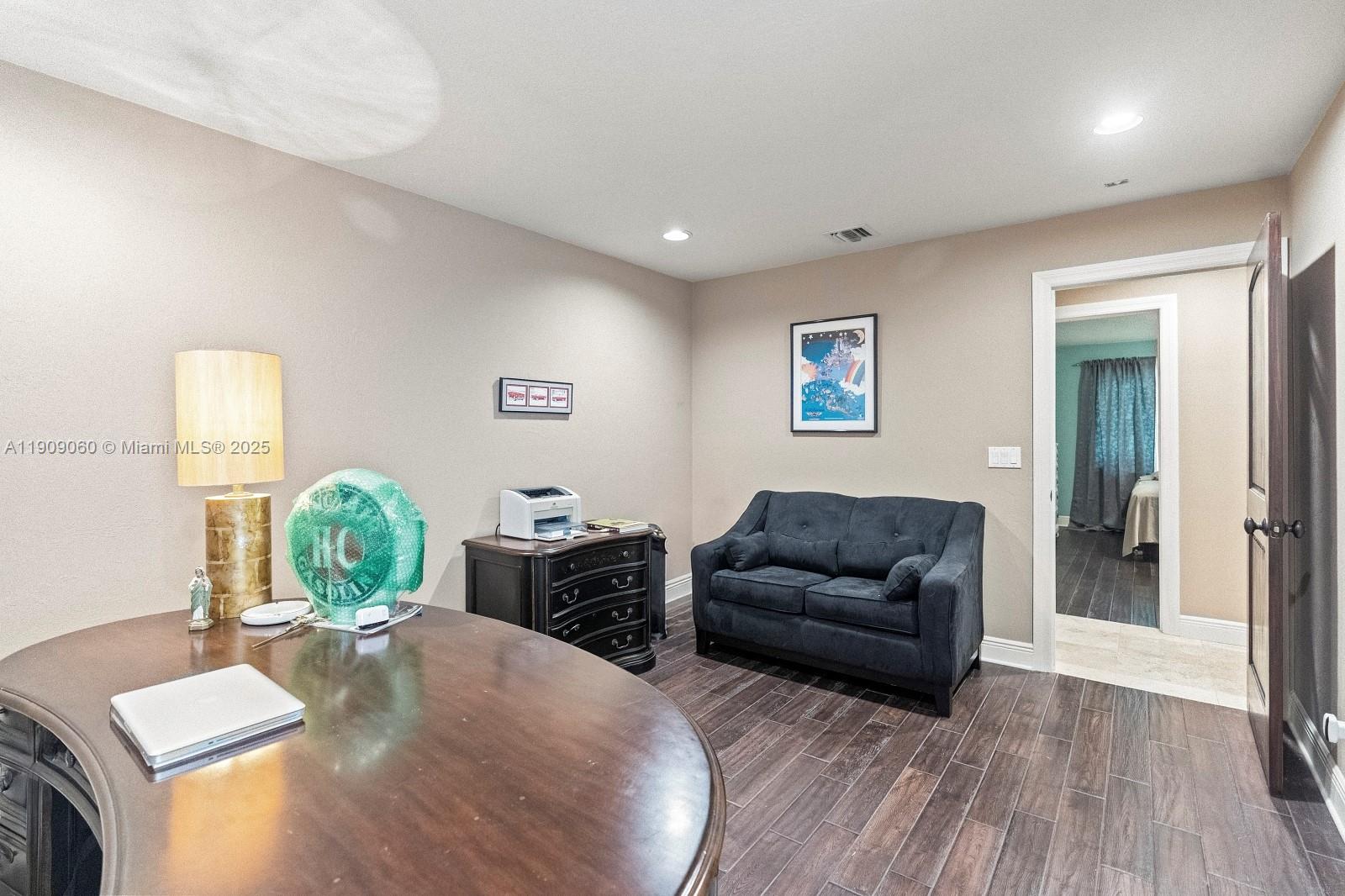 6500 Southwest 127th Street Pinecrest, FL 33156 - Photo 39 of 68 a living room with furniture and a wooden floor
