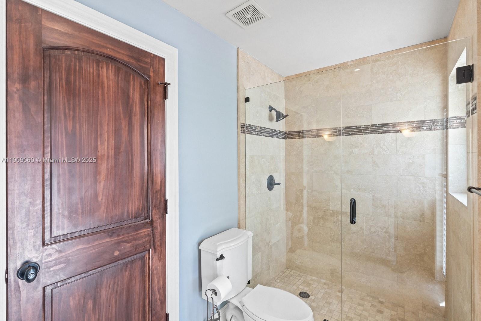 6500 Southwest 127th Street Pinecrest, FL 33156 - Photo 43 of 68 a bathroom with a toilet and a shower