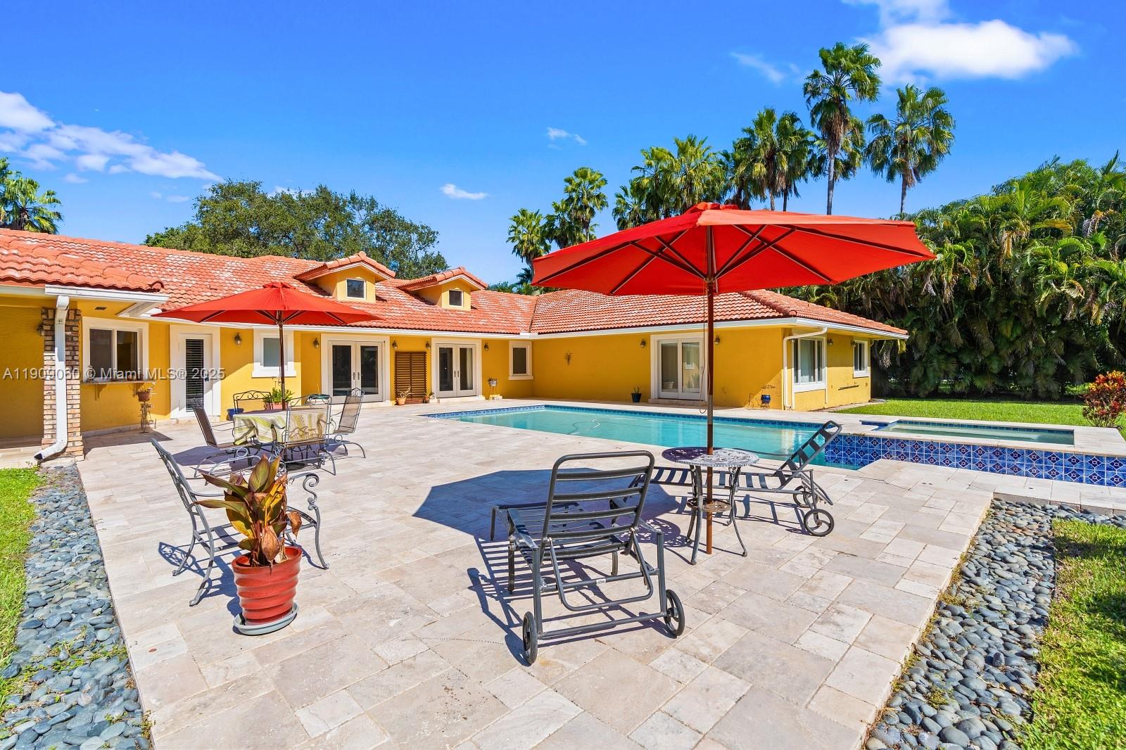 6500 Southwest 127th Street Pinecrest, FL 33156 - Photo 45 of 68 a view of a house with swimming pool and sitting area