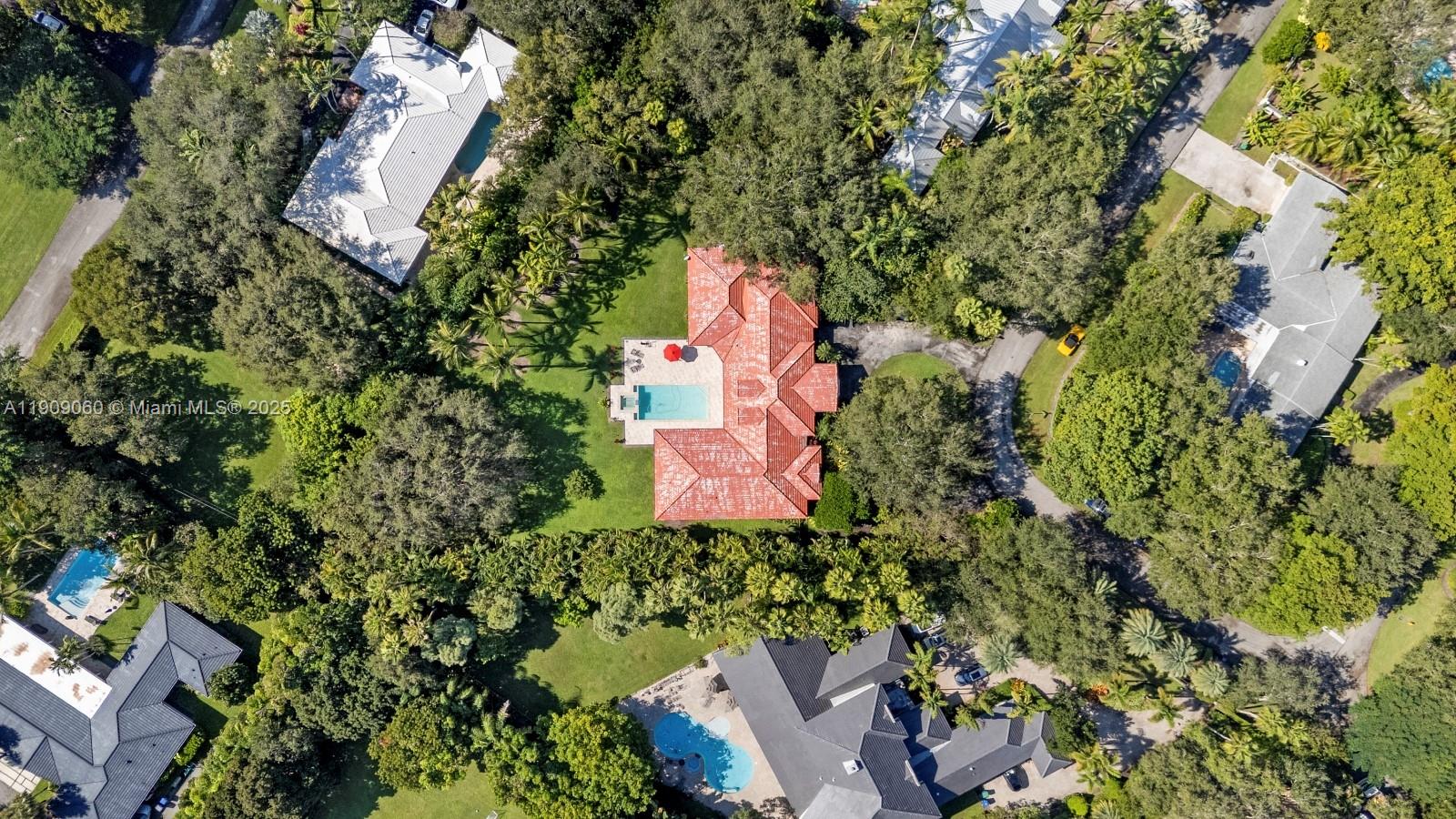 6500 Southwest 127th Street Pinecrest, FL 33156 - Photo 57 of 68 an aerial view of a house with a yard and outdoor seating