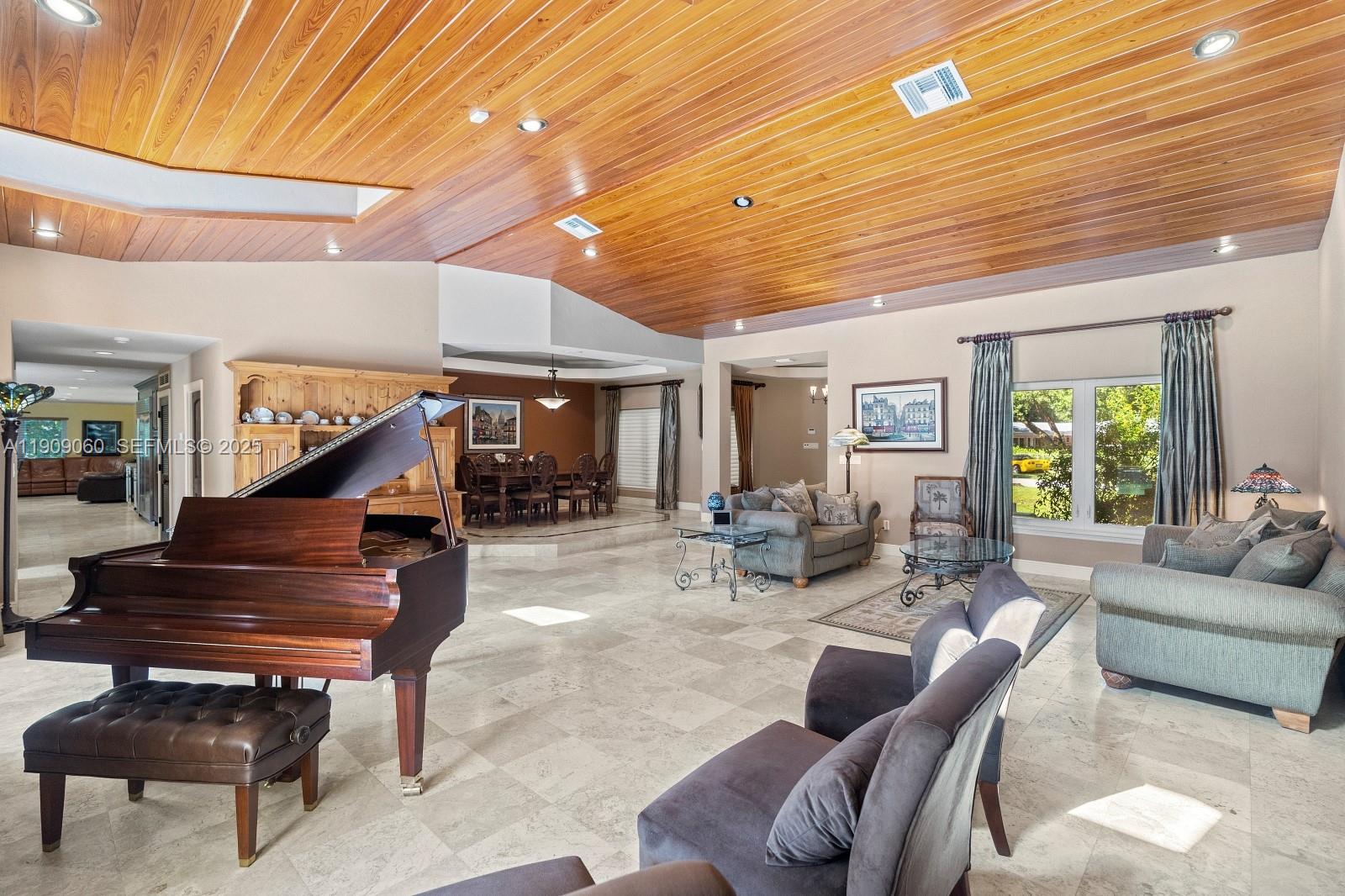 6500 Southwest 127th Street Pinecrest, FL 33156 - Photo 6 of 68 a living room with furniture and a piano