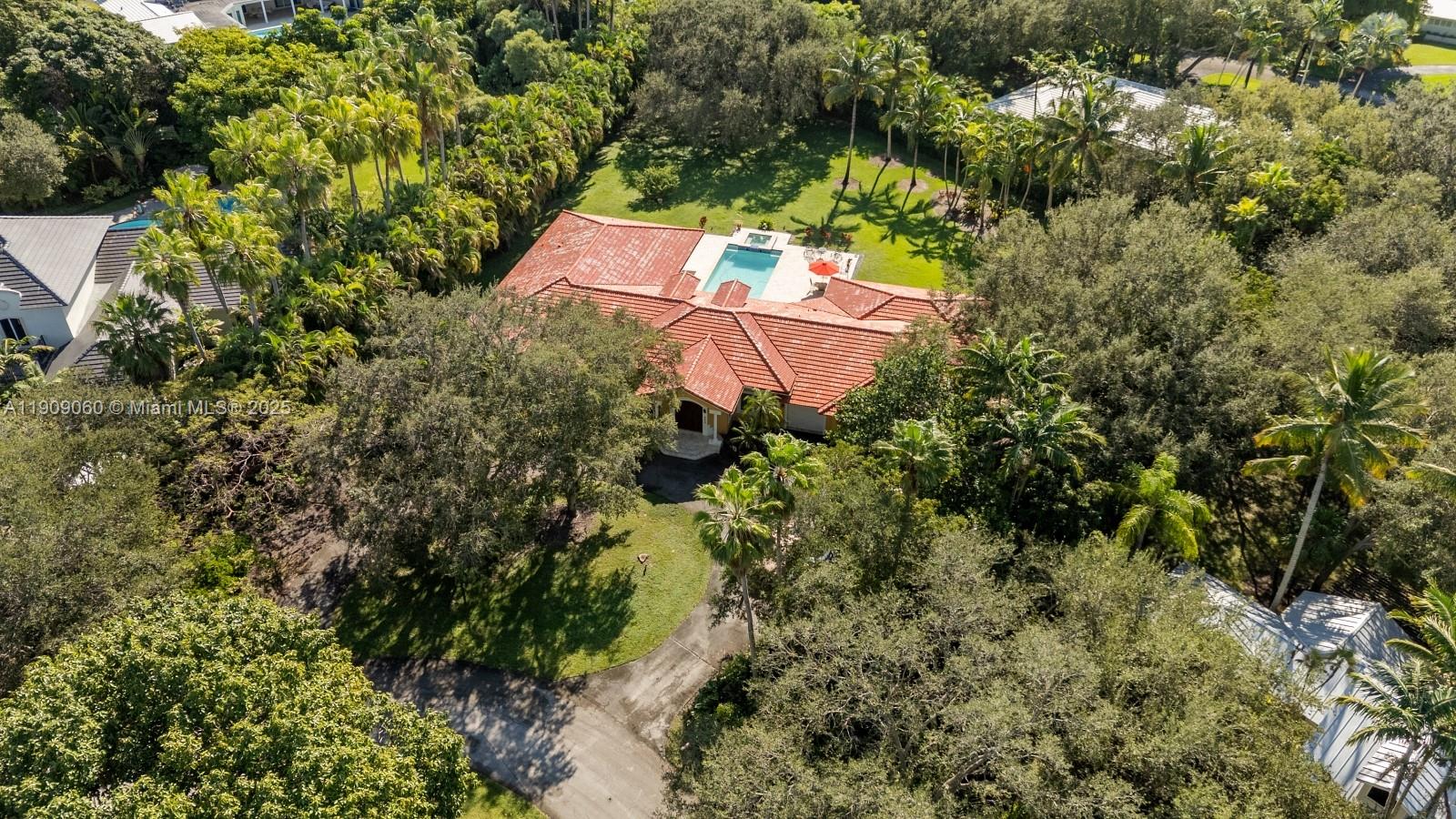 6500 Southwest 127th Street Pinecrest, FL 33156 - Photo 67 of 68 an aerial view of a house with a yard