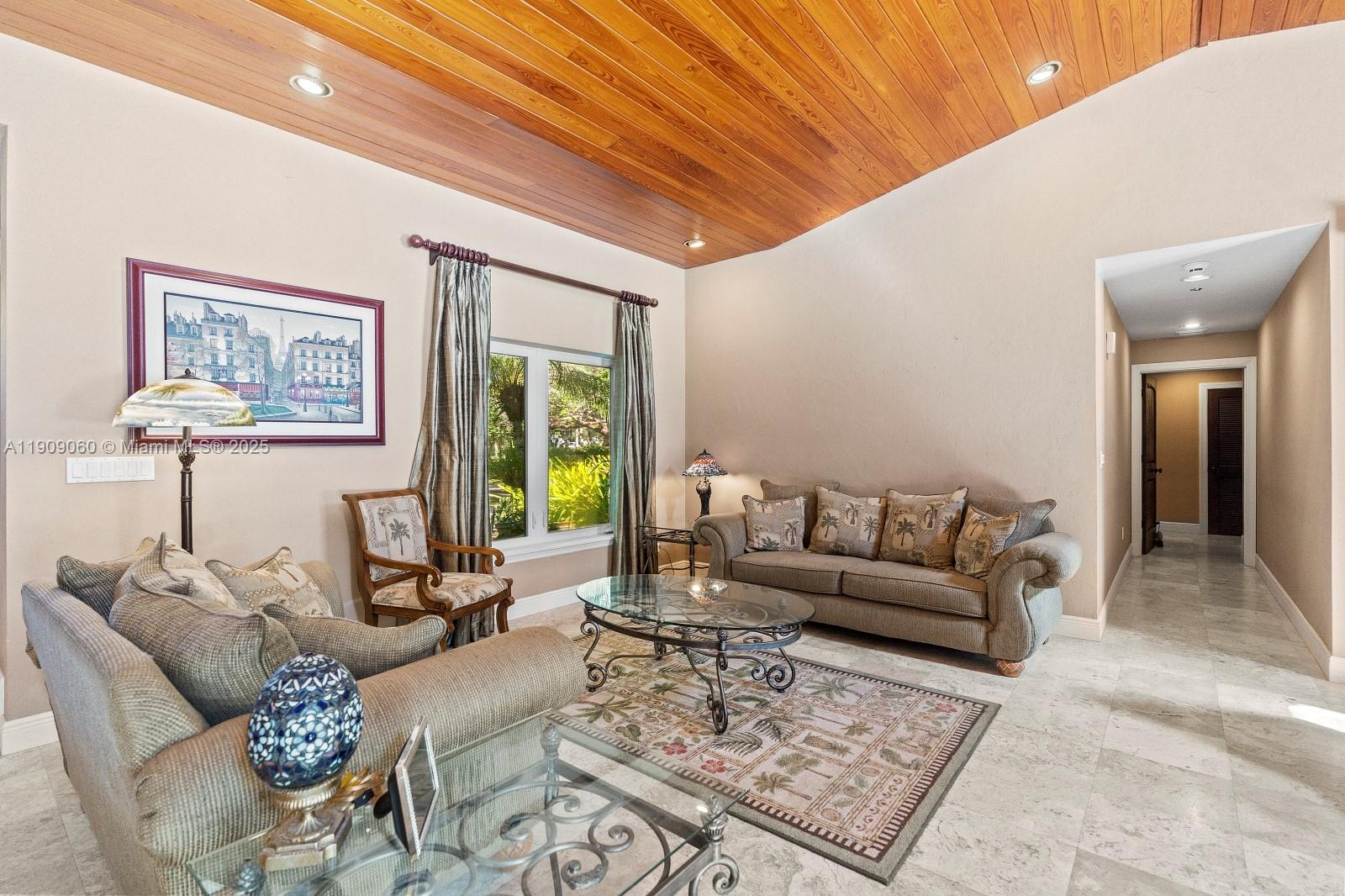 6500 Southwest 127th Street Pinecrest, FL 33156 - Photo 9 of 68 a living room with furniture and a rug