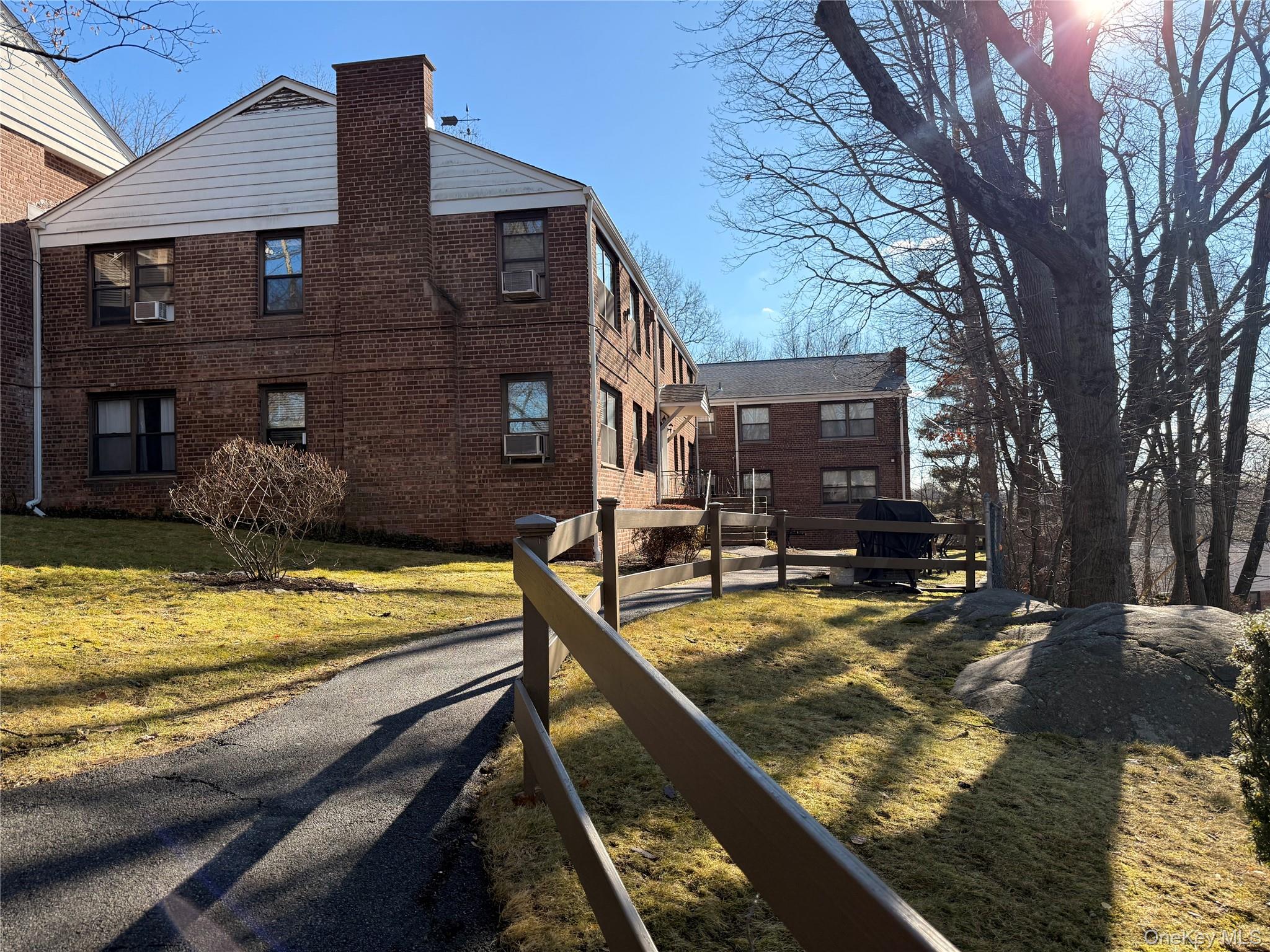 67 Rockledge Road, Unit 1B Hartsdale, NY 10530 - Photo 1 of 1 a view of a house with swimming pool