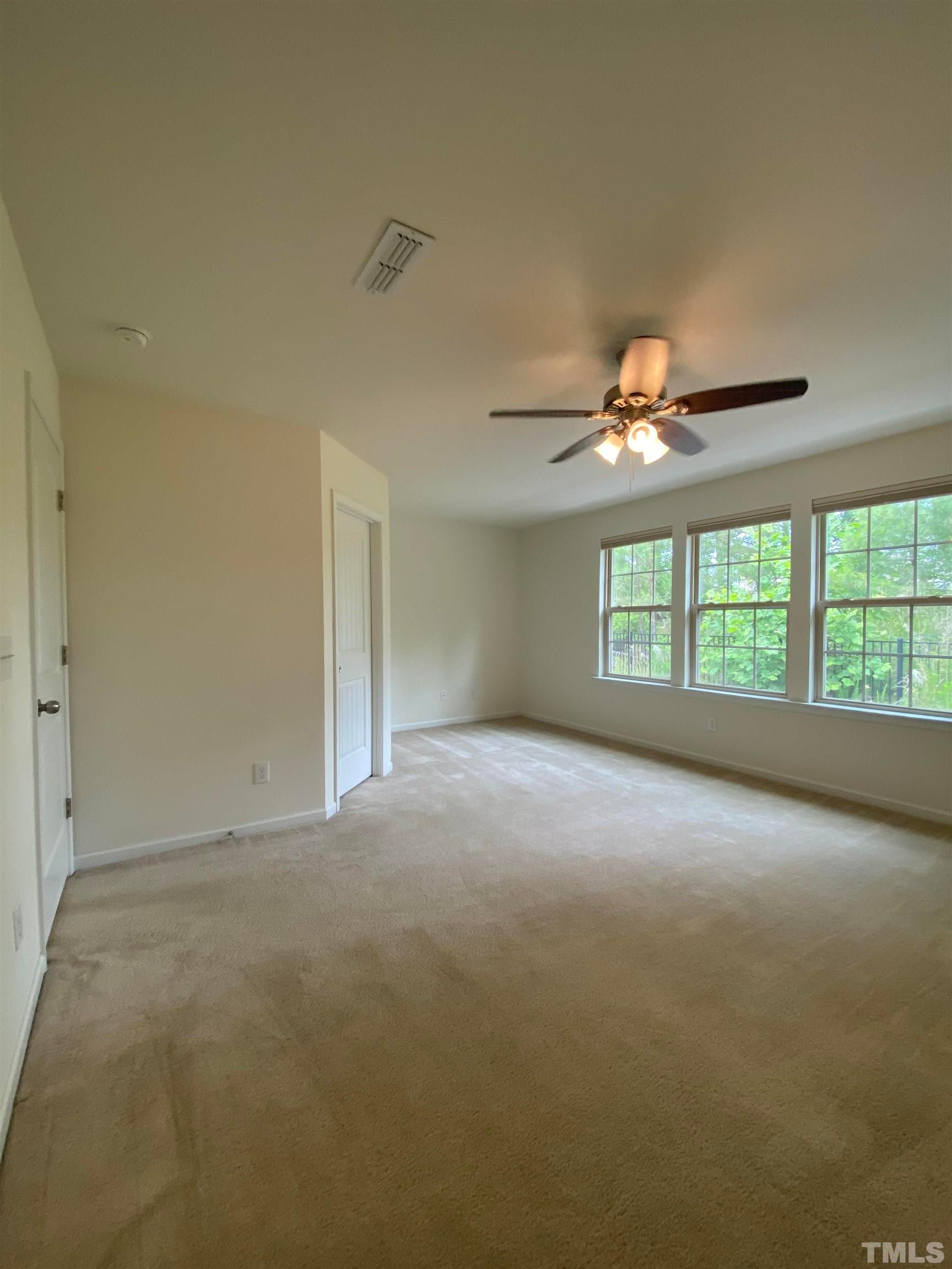 1458 Chatuga Way Wake Forest, NC 27587 - Photo 13 of 25 a view of an empty room with a window
