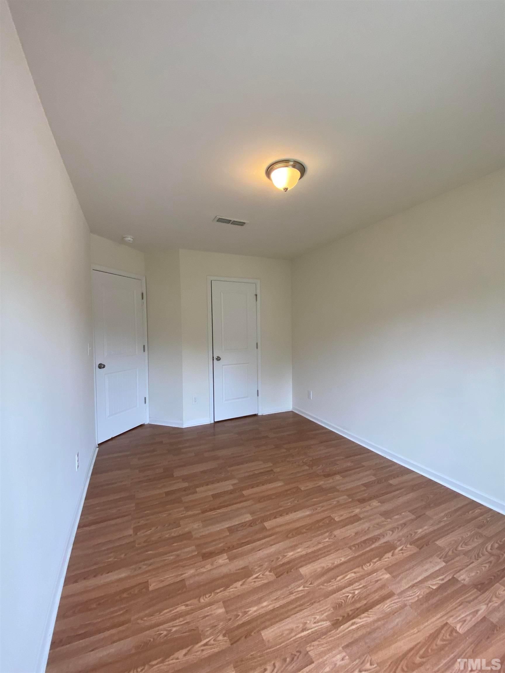 1458 Chatuga Way Wake Forest, NC 27587 - Photo 15 of 25 a view of empty room with wooden floor