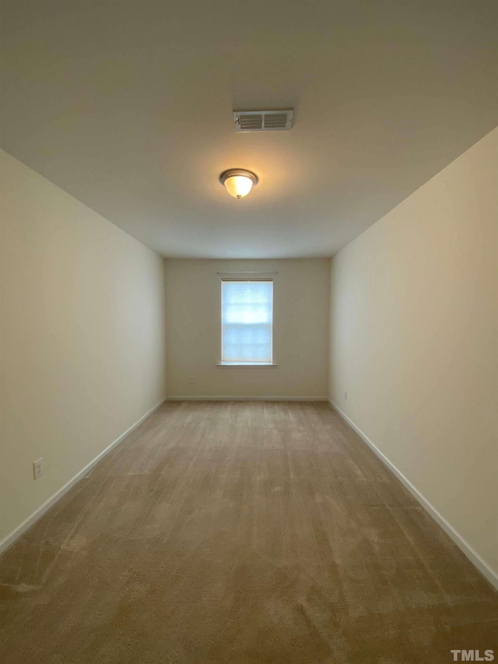 1458 Chatuga Way Wake Forest, NC 27587 - Photo 19 of 25 a view of an empty room and a window