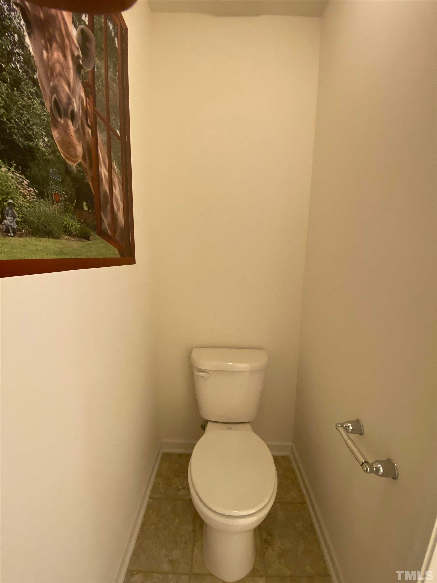 1458 Chatuga Way Wake Forest, NC 27587 - Photo 8 of 25 a white toilet sitting next to a white wall