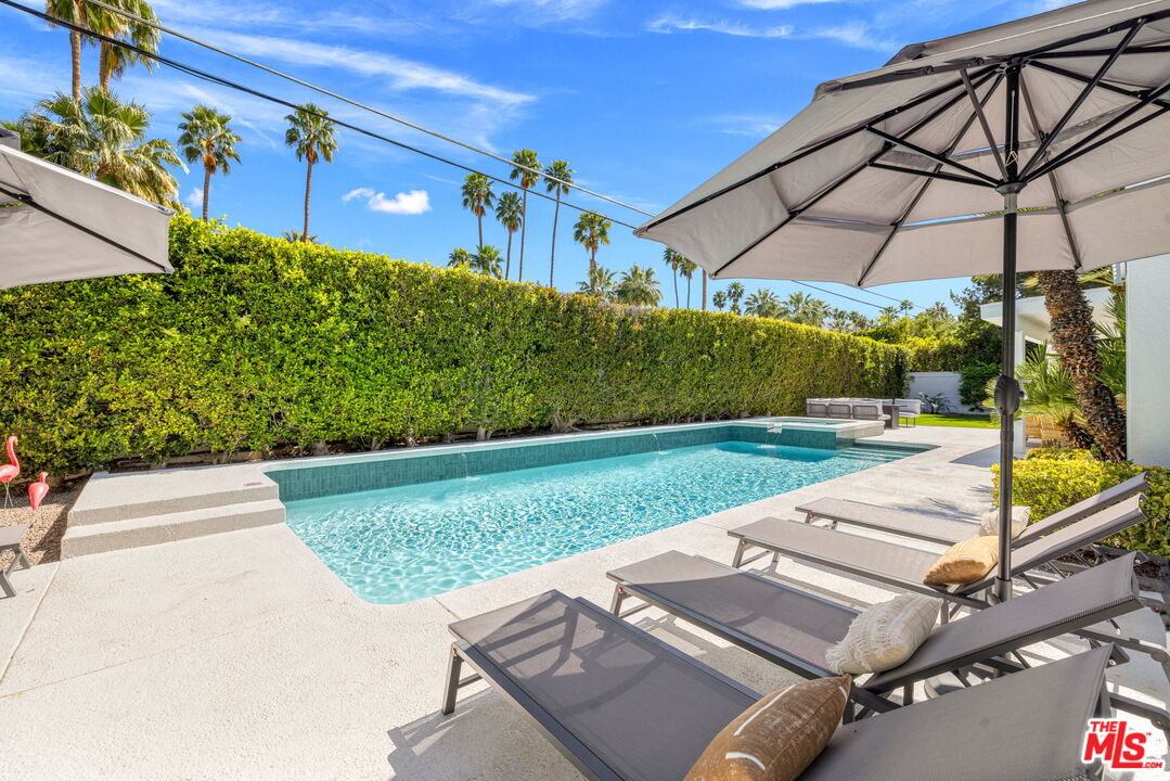 1414 Sagebrush Road Palm Springs, CA 92264 - Photo 41 of 48 a view of a backyard with potted plants