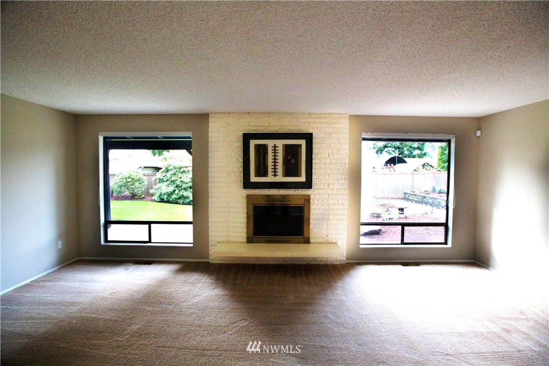 4601 Northeast 24th Street Renton, WA 98059 - Photo 11 of 25 wooden floor in an empty room with a window