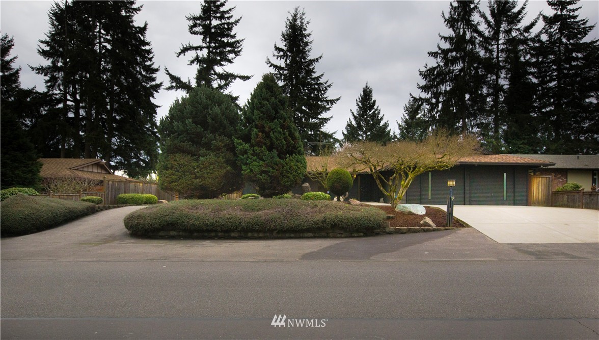 4601 Northeast 24th Street Renton, WA 98059 - Photo 19 of 25 a front view of a house with a yard